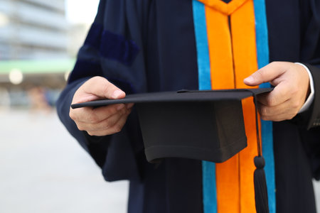 graduation,Student hold hats in hand during commencement success graduates of the university,Concept education congratulation.Graduation Ceremony,Congratulated the graduates in University.の写真素材