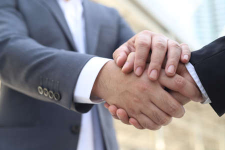 Businessmen shake hands Greet each other and cooperate Agree to work together for future job duties. Successの写真素材