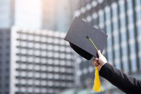 Close up Graduate holding a hat. Concept success education in University with copy space.の写真素材