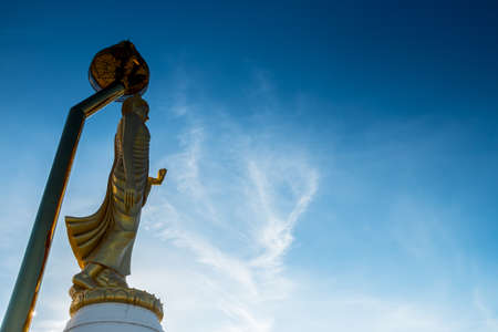 Buddha statue in blue sky の写真素材