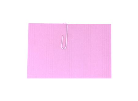 A white paperclip with blank purple notepaper. Purple sheet for your message or adding more text. Memo note with paper clipの写真素材