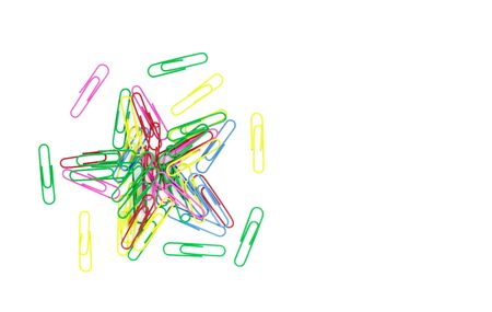 Series of colorful paper clips with star shape on white background. Decorative paper clips in pink, yellow, green, red and blue colorsの写真素材