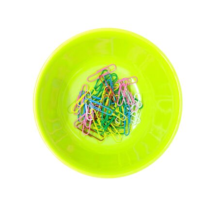 collection of paper clips in a green bowl. Decorative paper clips and a bowlの写真素材