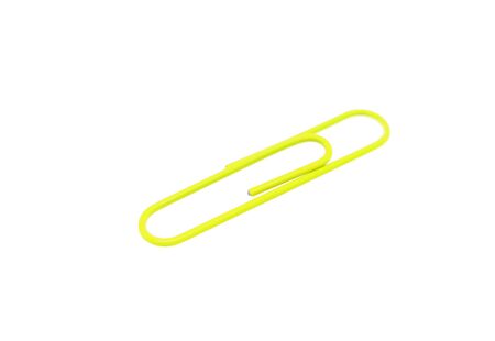 Single yellow paper clip on a white background. One paper clip imageの写真素材