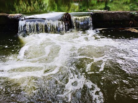 Beautiful view of the river flow. Nature shallow river. Beauty of water dropletsの写真素材