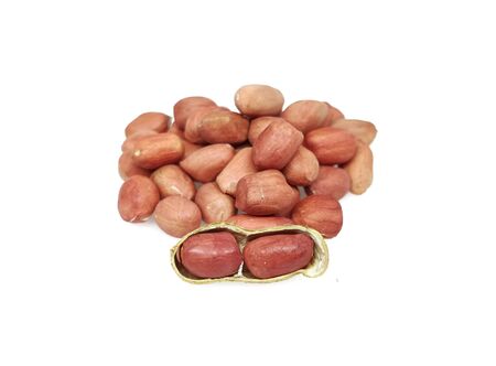 Pile peanut Seeds isolated on white background. Fresh peanuts in closeupの写真素材