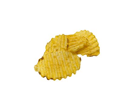 Crispy potato chips isolated on white background. Tasty fried potato slices in closeupの写真素材