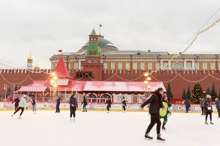 MOSCOW, RUSSIA - December 04 2019: People are ice skating on ice rink at Red Square.のeditorial素材