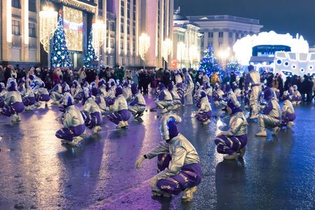 Russia, Moscow, January 2, 2020: New Year celebration on Mohovaya street. Festival "Christmas Journey". The street has become a pedestrian, the actors in the clothes of inoplanetyan dancing on Mohovaya streetのeditorial素材
