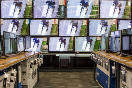 Russia, Moscow, March 2018: TVs stand on shelves in large shop. Shop of technics and electronicsのeditorial素材