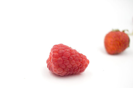 Delicious summer berries: blueberries, strawberries, raspberries on a white background, close-up