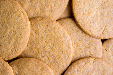 Background of round ginger biscuits closeup
