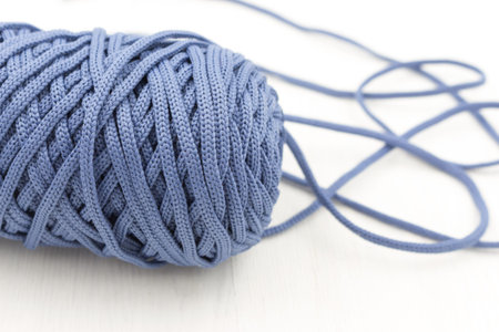 blue polyester cord, skein, close-up, background