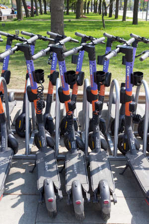 Moscow, Russia - May 13, 2021: Electric scooters in the parking lot of the rental stationのeditorial素材