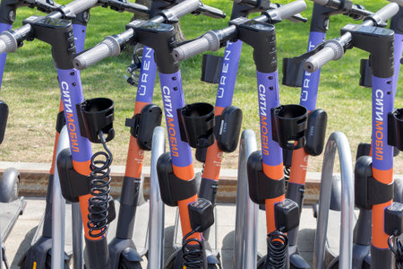 Moscow, Russia - May 13, 2021: Electric scooters in the parking lot of the rental stationのeditorial素材