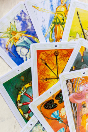 Moscow, Russia, June 11, 2021: Tarot cards are scattered on the table, close-up, fragment.のeditorial素材