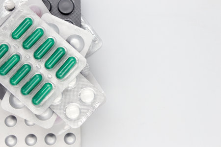 Many different tablets in blister packs, on a white background, copy space.の写真素材