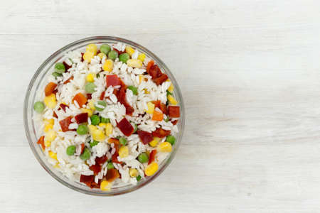 Frozen mixture of rice and vegetables, food background, close-upの写真素材