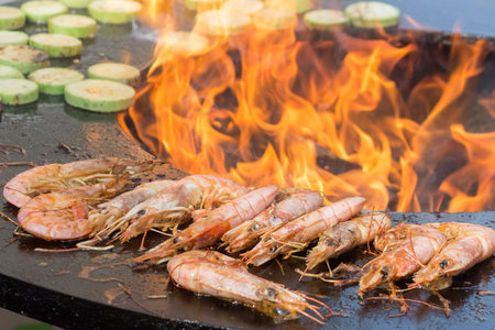 Grilled shrimp and zucchini. open fire. close-up.