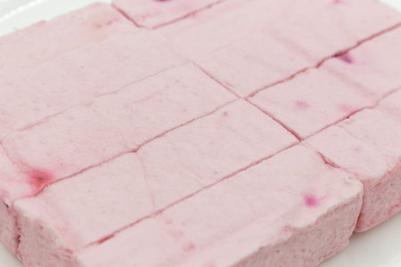 Pink fruit marshmallow with cranberries closeup. food background.