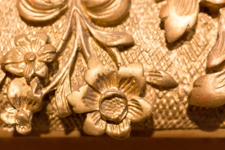 Fragment of an ancient gold picture frame, wood carving close-upの写真素材
