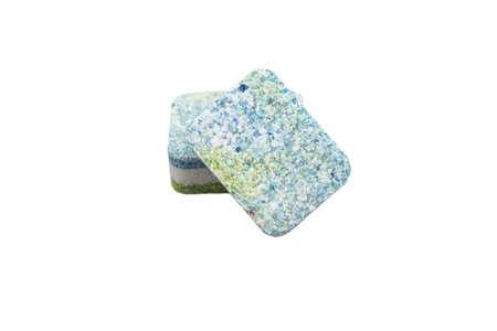 Dishwasher tablets isolated on white background. Three-layer rectangular tablets made of layers of...