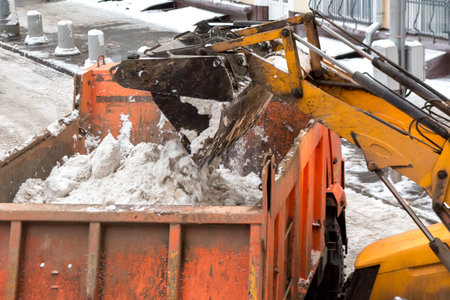 Dirty snow is loaded into a truck for transportation to the snow-melting plant plant.