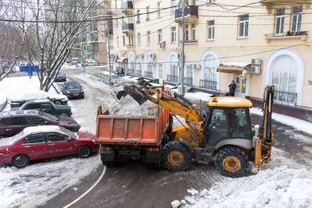Dirty snow is loaded into a truck for transportation to the snow-melting plant plant.