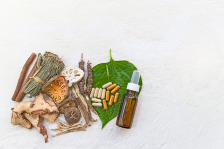 Top view of Dried herbs and Herbal medicine pill and Natural extracts cosmetics in a bottle on a...