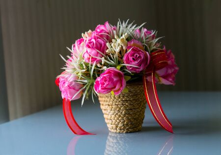 colorful flowers in a basketの写真素材