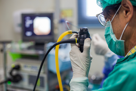 Doctor with modern equipment  and treatment to patient in hospital.の写真素材