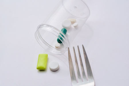 Medicine pills tablets and capsules on white plate for patient.の写真素材