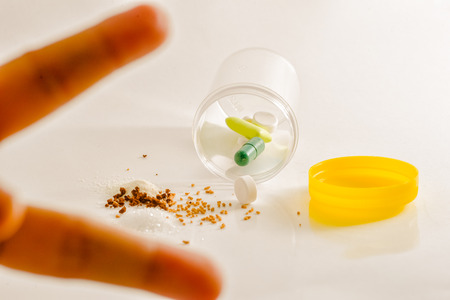 Medicine pills tablets and capsules on white plate for patient.の写真素材