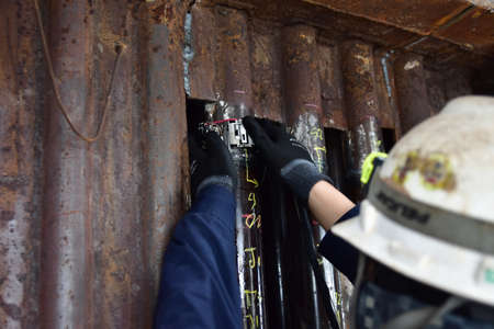 Engineering use the Phased Array Ultrasonics (PAUT) inspect the welding of water tube in power plant. Focus inspection area.の写真素材