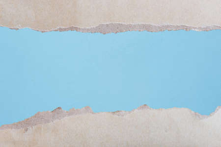 Tears Paper With Blue Wall Backgroundの写真素材
