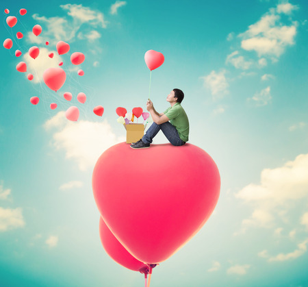 Man With Heart Balloons,Valentines Day Backgroundの写真素材