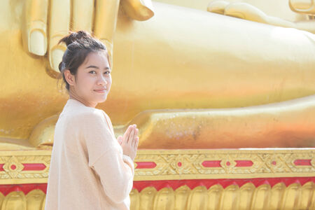 Thai Culture,Asian Teenager Praying At Temple の写真素材