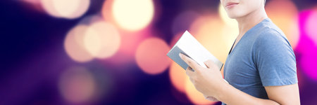 Man With Book Concept With Colorful Bokeh Lights Background,Banner Design