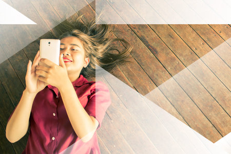 Modern Lifestyle Concept Image,Happy Beautiful Girl Laying on Floor Using Smartphone