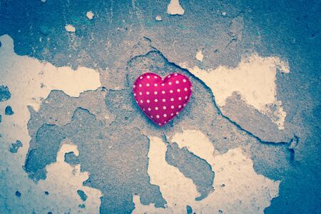 Red Heart on Grunge Wall Background,Concept of Love,Valentines Day Backgroundの写真素材