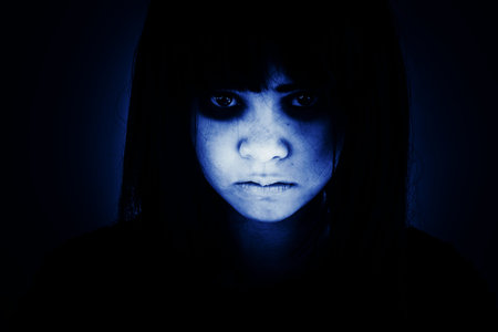 Portrait of scary girl staring at cameras,Ghost girl hiding from the dark,Horror background for halloweenの写真素材