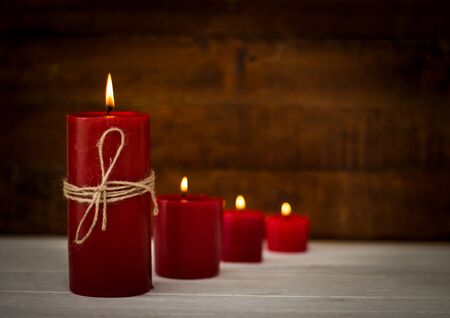 Red candles on wooden floor,Festive or spa concept ideas backgroundの写真素材