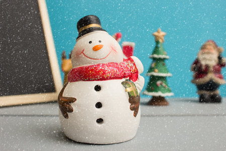 Christmas ornament with snowman in snow