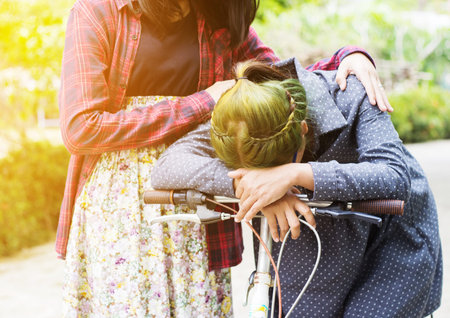 Friends hugging and giving consolation