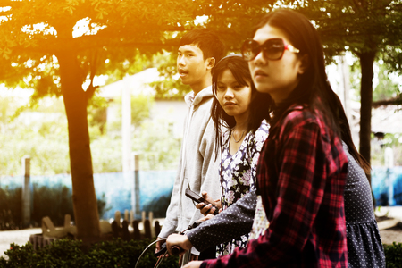 Group of asian teenager walking in the parkの写真素材