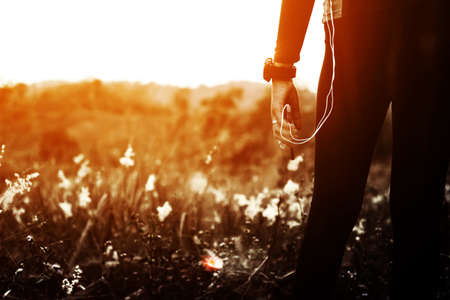 Woman exercising outdoor at sunsetの写真素材