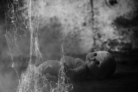 Spooky doll in haunted houseの写真素材