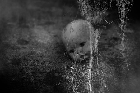 Spooky doll in haunted houseの写真素材