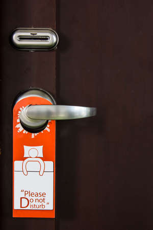 Vector hotel handles with hanging signs の写真素材