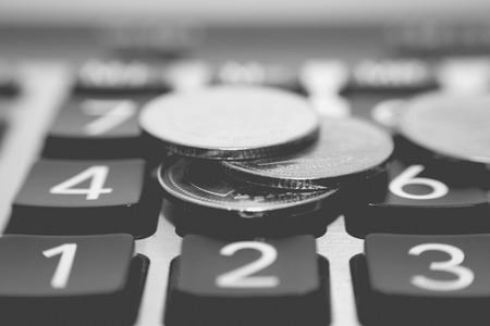 Finance and banking concept. Close up coins and calculator. For business and financial background.の写真素材